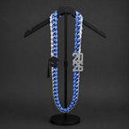 3 strand Blue and white custom Ribbon Lei on a black stand against a dark background